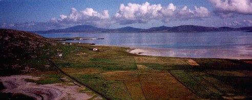 Photo from Dun Scurrival overlooking Eoligarry, Eriskay and South Uist